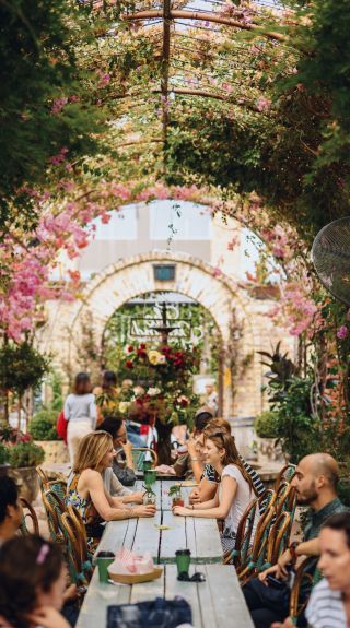 People enjoying food and wine at The Grounds of Alexandria, Sydney