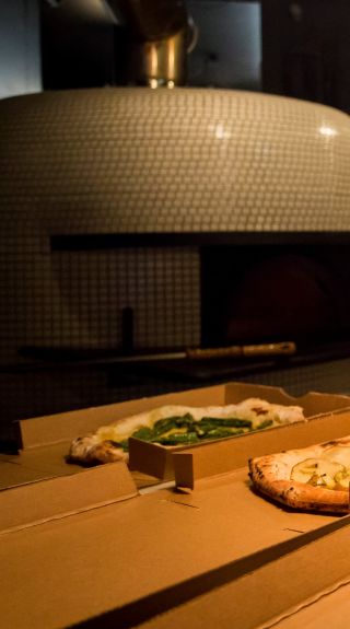 Chef preparing pizza's at Gigi Pizzeria in Newtown, Sydney