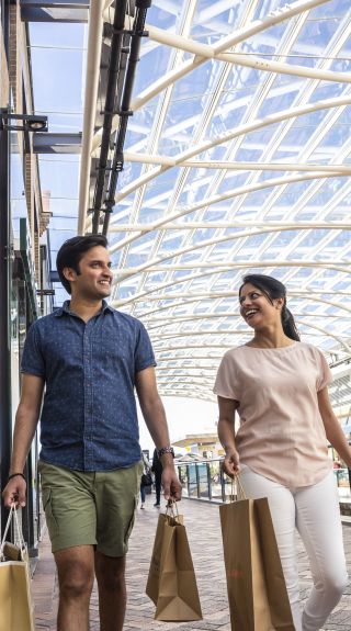 Couple enjoying a visit to Birkenhead Point Brand Outlet centre in the Inner Western Sydney suburb of Drummoyne, Inner Sydney