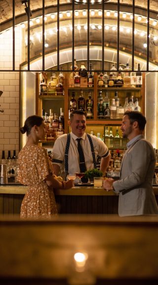 Couple ordering cocktails at Palmer and Co., Sydney