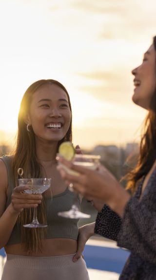 Friends enjoying drinks at sunset at The William Inglis Hotel, Warwick Farm in Sydney's south west