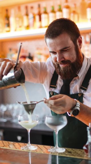 Bartender creating cocktails at Nick and Nora's bar in Parramatta, Sydney West