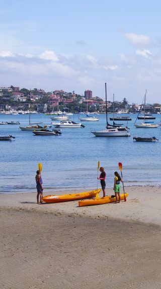 Friends enjoying a day of kayaking on Sydney Harbour, Sydney