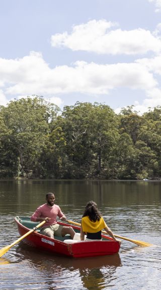 Couple enjoying a day out on Hunts Creek, Parramatta with Parramatta Rowboats