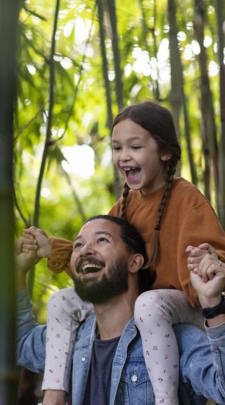 Family enjoying a visit to The Ian Potter Children's Wild Play Garden in Centennial Park