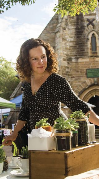 Woman browsing homewares at Balmain Markets, Sydney's third-oldest markets, Balmain