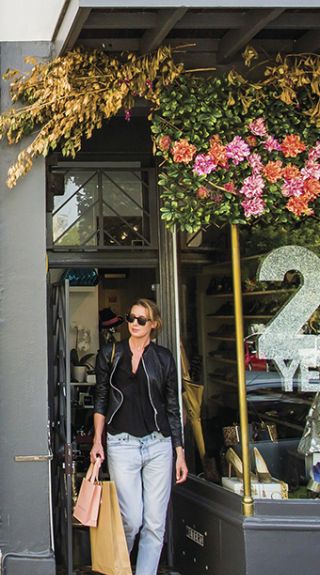 Woman shopping at Pelle Designer Recycled store, William Street in Paddington