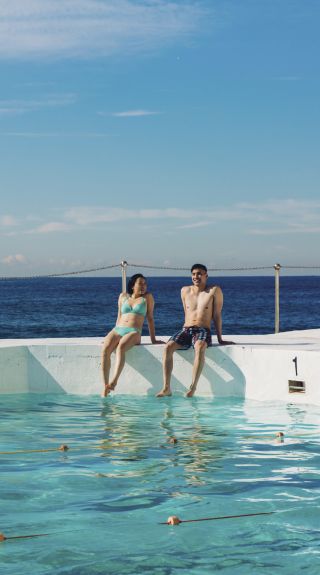 Couple enjoying a morning swim at Bondi Icebergs, Bondi Beach