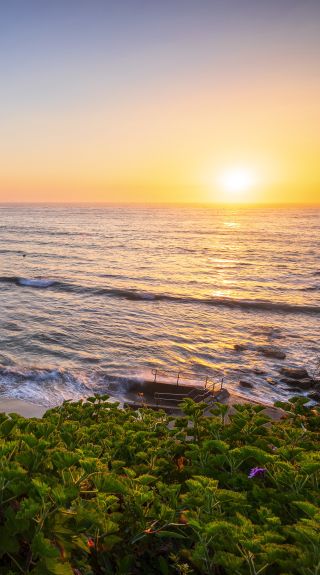 Morning sun rising over Bondi Beach, Sydney