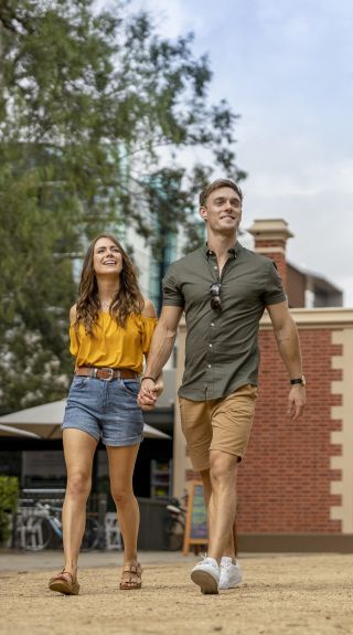 Couple enjoying a walk through Parramatta Park, Parramatta in Sydney's west