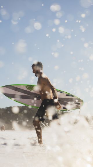 Man enjoying the surf at North Narrabeen Beach, North Narrabeen