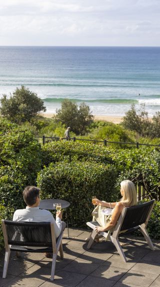 Couple enjoying a glass of champagne at Pilu at Freshwater in the Northern Beaches of Sydney