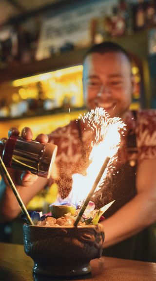 Bartender creating a specialty cocktail at Jacoby’s Tiki Bar in Enmore, Newtown