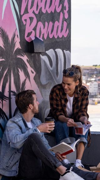 Couple relaxing at Noahs Bondi, Bondi Beach