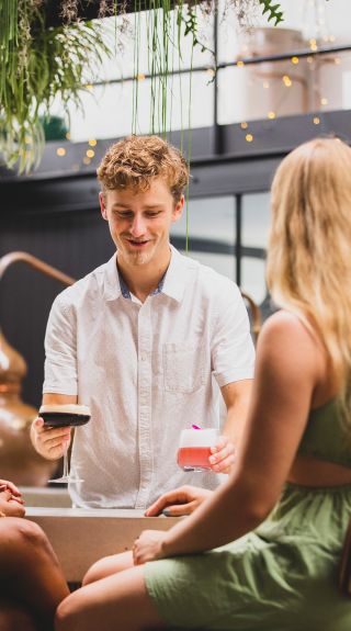Friends enjoying cocktails, Seadrift Distillery, Brookvale