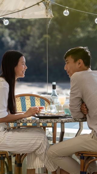 Couple enjoying food and drink, Bathers Pavilion, Mosman