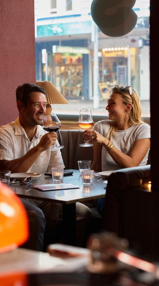 Couple drinking in the booth, Oxford House, Paddington - Credit: Steven Woodburn