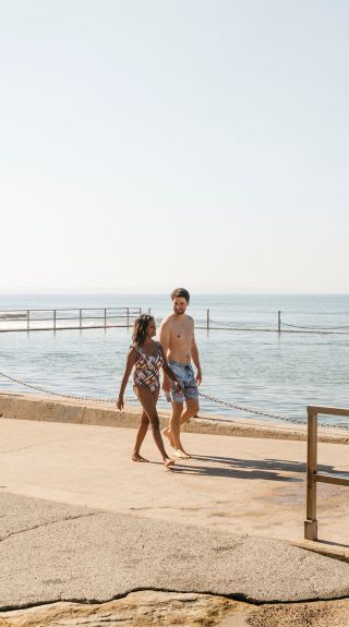 Couple enjoying a day in sun, Cronulla Rock Pool, Cronulla
