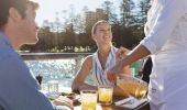 Couple enjoying food and drinks at Hugos Manly at Manly Wharf