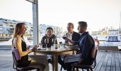 Friends enjoying food and drink at waterside restaurant LuMi Bar & Dining, Pyrmont