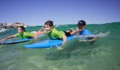 Children learning to surf with 'Let's Go Surfing' at Bondi