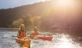 Couple kayaking in afternoon sun, Hawkesbury River 