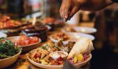 Chef creating a mixed plate at Cairo Takeaway on Enmore Road, Newtown in Sydney's inner west