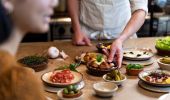 Chef preparing tapas for diners at Una MÃ¡s restaurant on the middle level of the Coogee Pavilion, Coogee