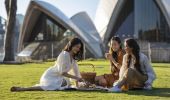 Friends enjoying a picnic in the Royal Botanic Garden, Sydney City