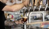 Bartender pouring a brown ale available from Batch Brewing Company, Petersham