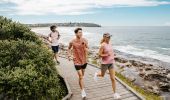Friends enjoying coastal run, Freshwater Beach