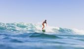 Surfer riding a wave off, Bilgola Beach