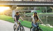 Couple enjoys a leisurely bike ride, Parramatta River Walk, Parramatta