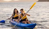 Friends enjoying a sunrise kayaking experience, Pittwater Kayak Tours, Palm Beach