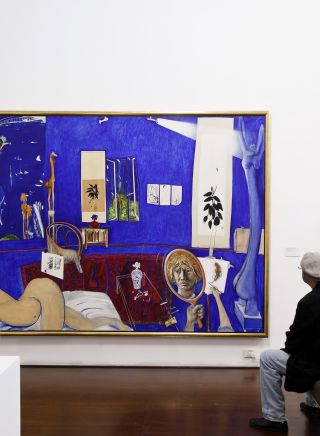 A man admiring artworks at Brett Whiteley Studio in Surry Hills, Sydney