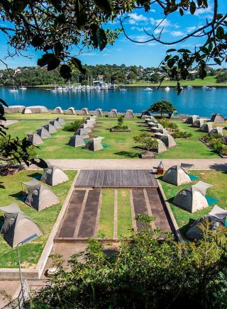 Camping tents set up on Cockatoo Island in Sydney Harbour