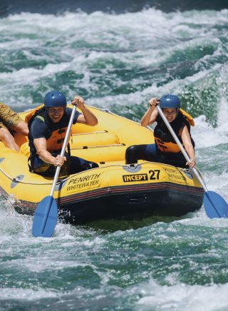 Couple enjoying a white water rafting experience at Penrith Whitewater Stadium in Sydney West
