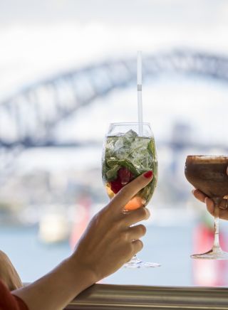Friends enjoying drinks with a view at Hacienda Bar, Pullman Quay Grand Sydney Harbour, Sydney City