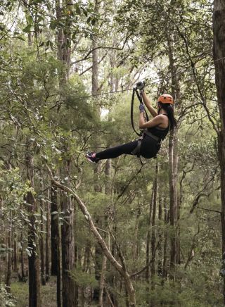 Woman enjoying a day out at the TreeTops Central Coast attraction in Wyong Creek, Central Coast