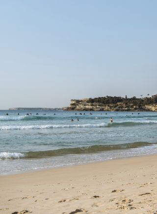 Couple enjoying a walk along Bondi Beach in Bondi, Sydney