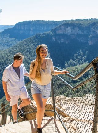 Couple enjoying a walk along the Wentworth Falls Track in the Blue Mountain National Park