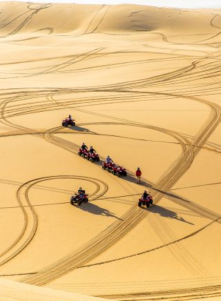 Race along soaring coastal sand dunes
