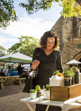 Woman browsing homewares at Balmain Markets in Balmain