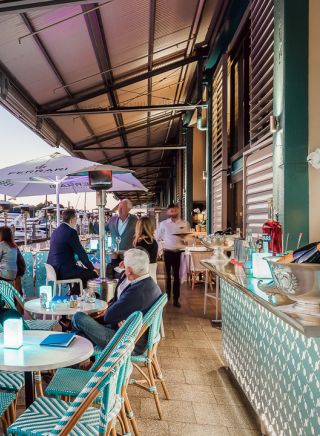 People sitting at Manta Restaurant near a marina, Woolloomooloo - Credit: Manta Restaurant