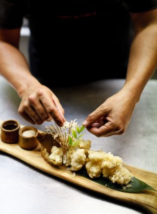 Chef preparing a dish at Toko Restaurant and Bar in Surry Hills