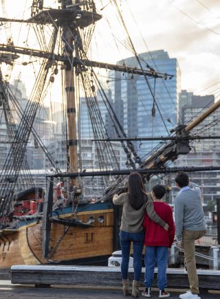 Family exploring the HMB Endeavour, an Australian-built replica of James Cook's ship on exhibit at the Australian National Maritime Museum, Darling Harbour.