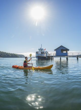 Friends kayaking on Pittwater at Bennets Wharf, Coasters Retreat