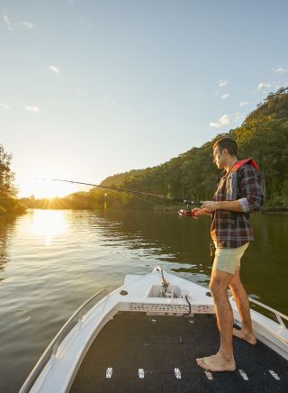 Man enjoying an afternoon of fishing on the Hawkesbury River, Wisemans Ferry