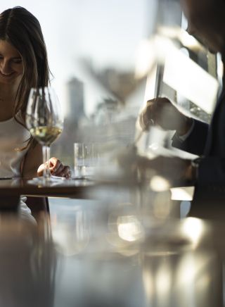 Couple enjoying food and drink at Quay Restaurant, The Rocks