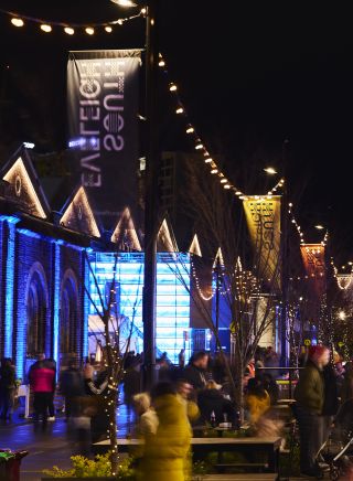 Attendees enjoying a night out at the South Eveleigh Solstice Festival, South Eveleigh